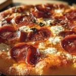 Hot Honey Pepperoni Ricotta Pizza with drizzled honey and crispy pepperoni