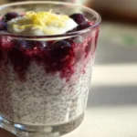 Lemon Blueberry Chia Seed Pudding in a glass topped with fresh blueberries