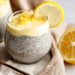 Lemon cream chia pudding made with oat milk in a glass jar garnished with lemon zest.